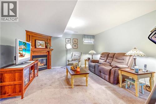 24 Griffiths Drive Unit# 9, Paris, ON - Indoor Photo Showing Living Room With Fireplace