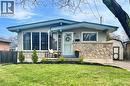 Single-story residence featuring light gray siding with blue trim accents and a partial stone facade - 241 Thorner Drive, Hamilton, ON  - Outdoor 
