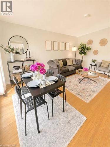 Open concept living area featuring wood-finish flooring - 241 Thorner Drive, Hamilton, ON - Indoor
