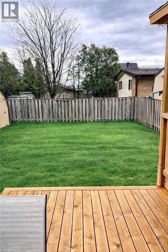 Edited with AI to help you visualize what the grass could look like if re-sodded - 241 Thorner Drive, Hamilton, ON - Outdoor With Deck Patio Veranda