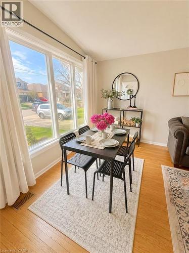 Bright dining area with wood-finish flooring - 241 Thorner Drive, Hamilton, ON - Indoor Photo Showing Dining Room