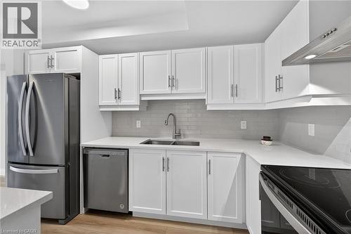 Quartz Counters - 153 Wilson Street W Unit# 310, Ancaster, ON - Indoor Photo Showing Kitchen With Stainless Steel Kitchen With Double Sink