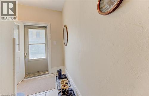 Front entryway with white baseboards, and neutral wall tones. - 48 Breithaupt Street, Kitchener, ON - Indoor Photo Showing Other Room