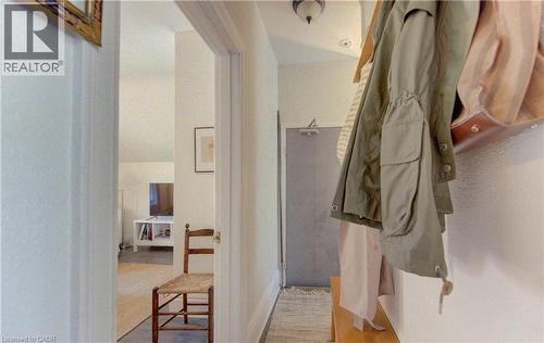 Hallway featuring white walls, wood-finish flooring, and a flush-mount ceiling light - 48 Breithaupt Street, Kitchener, ON - Indoor Photo Showing Bathroom