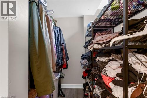 Organized closet space featuring wood-finish flooring and light-toned walls - 46 Beaconsfield Drive, Hamilton, ON - Indoor With Storage
