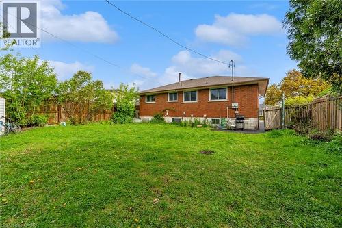 Expansive grassed backyard with mature perimeter trees and wood fencing - 46 Beaconsfield Drive, Hamilton, ON - Outdoor