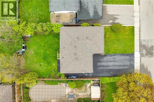 Overhead property view featuring a shingled roof, asphalt driveway, and green lawn - 46 Beaconsfield Drive, Hamilton, ON - Outdoor