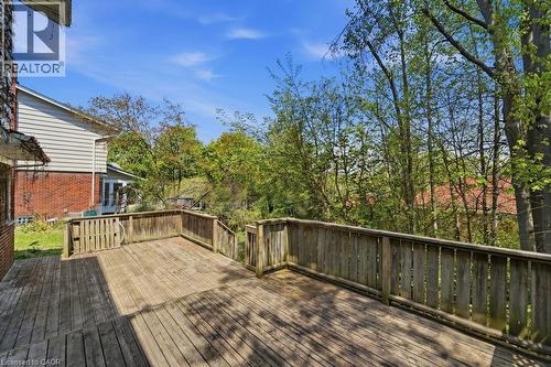 Expansive multi-level wood deck featuring a protective railing and integrated steps - 46 Birchcliff Avenue, Kitchener, ON - Outdoor With Deck Patio Veranda With Exterior