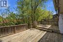 Multi-level wooden deck featuring slat railings and a lattice privacy screen - 46 Birchcliff Avenue, Kitchener, ON  - Outdoor With Deck Patio Veranda 