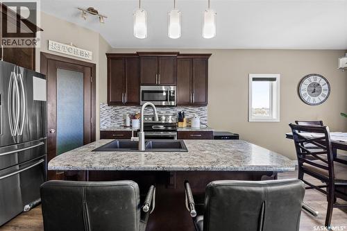 5044 Crane Crescent, Regina, SK - Indoor Photo Showing Kitchen With Double Sink With Upgraded Kitchen