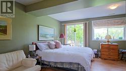 Primary bedroom with walk out to Lake - 
