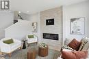 266 Kostiuk Crescent, Saskatoon, SK  - Indoor Photo Showing Living Room With Fireplace 