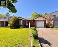 Brick exterior with a prominent bay window, attached single-car garage, and a lush front lawn - 146 Bechtel Drive, Kitchener, ON  - Outdoor With Facade 