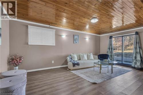 Living room featuring wood finished floors, crown molding, and wood ceiling - 146 Bechtel Drive, Kitchener, ON - Indoor