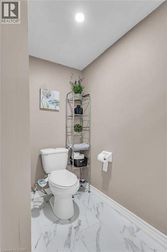 Bathroom featuring toilet and light marble finish flooring - 146 Bechtel Drive, Kitchener, ON - Indoor Photo Showing Bathroom