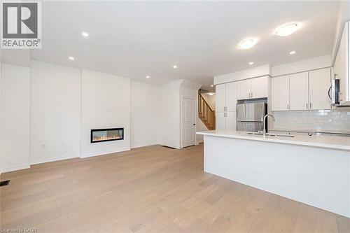 15 Linden Park Lane, Hamilton, ON - Indoor Photo Showing Kitchen With Fireplace With Double Sink