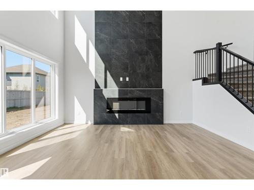 8727 181 Av Nw, Edmonton, AB - Indoor With Fireplace