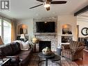 208 2Nd Avenue Se, Dorintosh, SK  - Indoor Photo Showing Living Room With Fireplace 