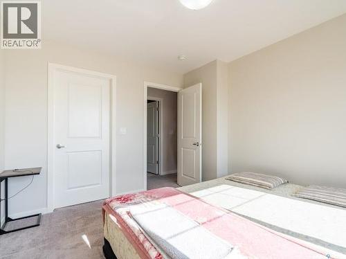 9 5752 Gordon Road, Regina, SK - Indoor Photo Showing Bedroom