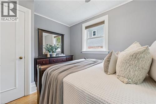 Hardwood flooring contrasting with light gray wall tones - 310 Kitchener Road, Cambridge, ON - Indoor Photo Showing Bedroom