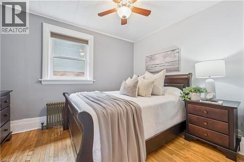 Hardwood flooring and a ceiling fan with integrated lighting - 310 Kitchener Road, Cambridge, ON - Indoor Photo Showing Bedroom