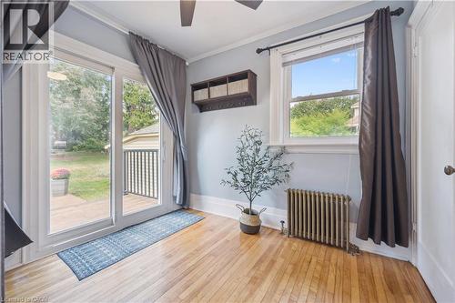 Hardwood flooring extending to a glass sliding door - 310 Kitchener Road, Cambridge, ON - Indoor Photo Showing Other Room