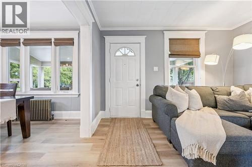 Light wood-finish flooring complements the neutral wall tones - 310 Kitchener Road, Cambridge, ON - Indoor Photo Showing Other Room