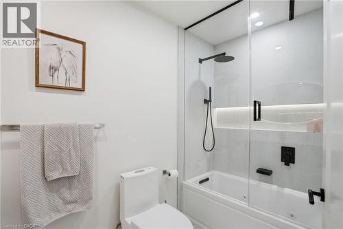 Contemporary bathroom featuring a combination tub and shower with a glass enclosure - 345 Rankin Drive, Burlington, ON - Indoor Photo Showing Bathroom