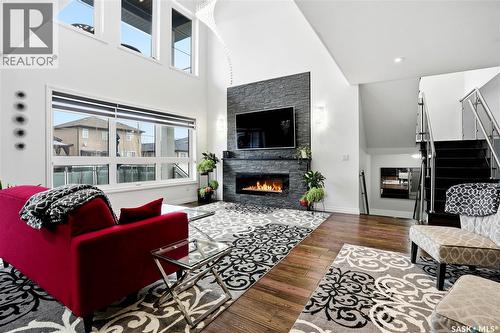 4714 E Green Apple Drive, Regina, SK - Indoor Photo Showing Living Room With Fireplace
