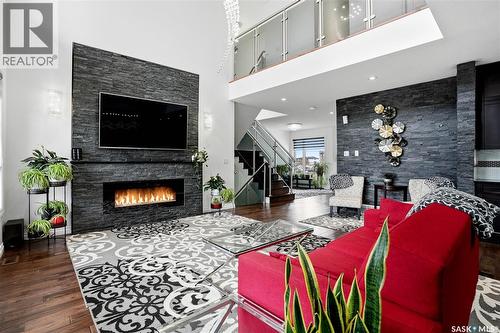 4714 E Green Apple Drive, Regina, SK - Indoor Photo Showing Living Room With Fireplace