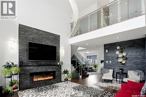 4714 E Green Apple Drive, Regina, SK - Indoor Photo Showing Living Room With Fireplace