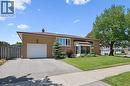 Brick exterior featuring a single-car garage, bay window, and covered front entry - 47 Oakhurst Crescent, Kitchener, ON  - Outdoor 