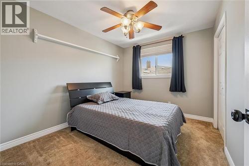 Neutral wall color with a window featuring blinds and dark drapes - 47 Oakhurst Crescent, Kitchener, ON - Indoor Photo Showing Bedroom