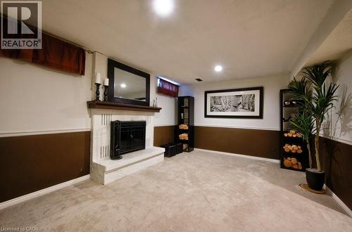 Basement Recreation room with wood burning fireplace - 270 Morrison Road Unit# 7C, Kitchener, ON - Indoor With Fireplace