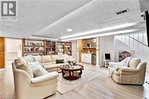 Finished lower level featuring wood-finish flooring - 91 Limerick Drive, Kitchener, ON - Indoor Photo Showing Living Room