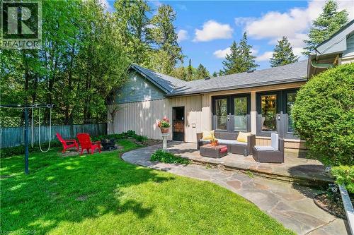 Expansive green lawn leading to a flagstone patio - 91 Limerick Drive, Kitchener, ON - Outdoor