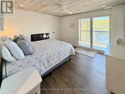 Primary Bedroom with Walkout and B/I Electric F/P - 