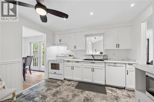 White kitchen featuring shaker-style cabinetry, a built-in range, and a dishwasher - 50 Lewis Crescent, Kitchener, ON - Indoor Photo Showing Kitchen