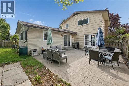 Expansive stamped concrete patio with multiple access points to the home - 50 Lewis Crescent, Kitchener, ON - Outdoor With Deck Patio Veranda With Exterior