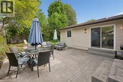 Spacious stamped concrete patio with multiple outdoor areas - 