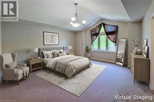 Spacious bedroom featuring vaulted ceilings, a large window, broadloom carpeting, and neutral wall tones - 197 Cloverleaf Drive, Ancaster, ON - Indoor Photo Showing Bedroom