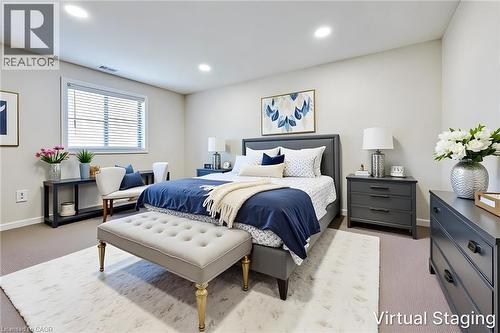 Spacious bedroom featuring recessed lighting, a large window with horizontal blinds, and neutral wall tones - 197 Cloverleaf Drive, Ancaster, ON - Indoor Photo Showing Bedroom