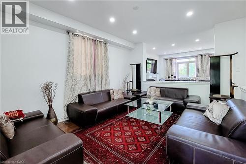 Open-concept living area featuring recessed lighting and light-toned walls - 197 Cloverleaf Drive, Ancaster, ON - Indoor Photo Showing Living Room
