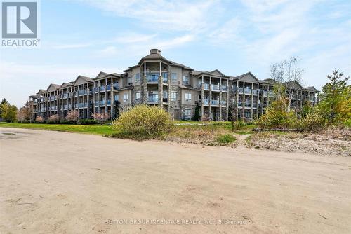 209 - 764 River Road E, Wasaga Beach, ON - Outdoor With Balcony With Facade