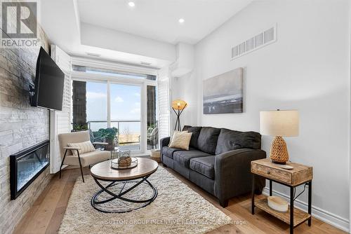209 - 764 River Road E, Wasaga Beach, ON - Indoor Photo Showing Living Room With Fireplace