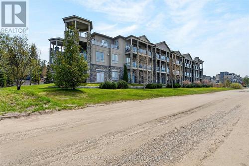 209 - 764 River Road E, Wasaga Beach, ON - Outdoor With Balcony With Facade