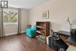 Bedroom 3 Office/Bedroom featuring wood-finish flooring and neutral wall tones - 