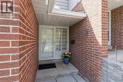 Brick exterior with white soffit and fascia - 