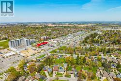 Aerial perspective showcasing a mixed-use neighborhood with residential areas and commercial establishments - 