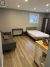 Open-concept living space with wood-finish flooring, recessed lighting, and a window with blinds - 61 E Waterloo Drive Unit# 61, Kitchener, ON  - Indoor 